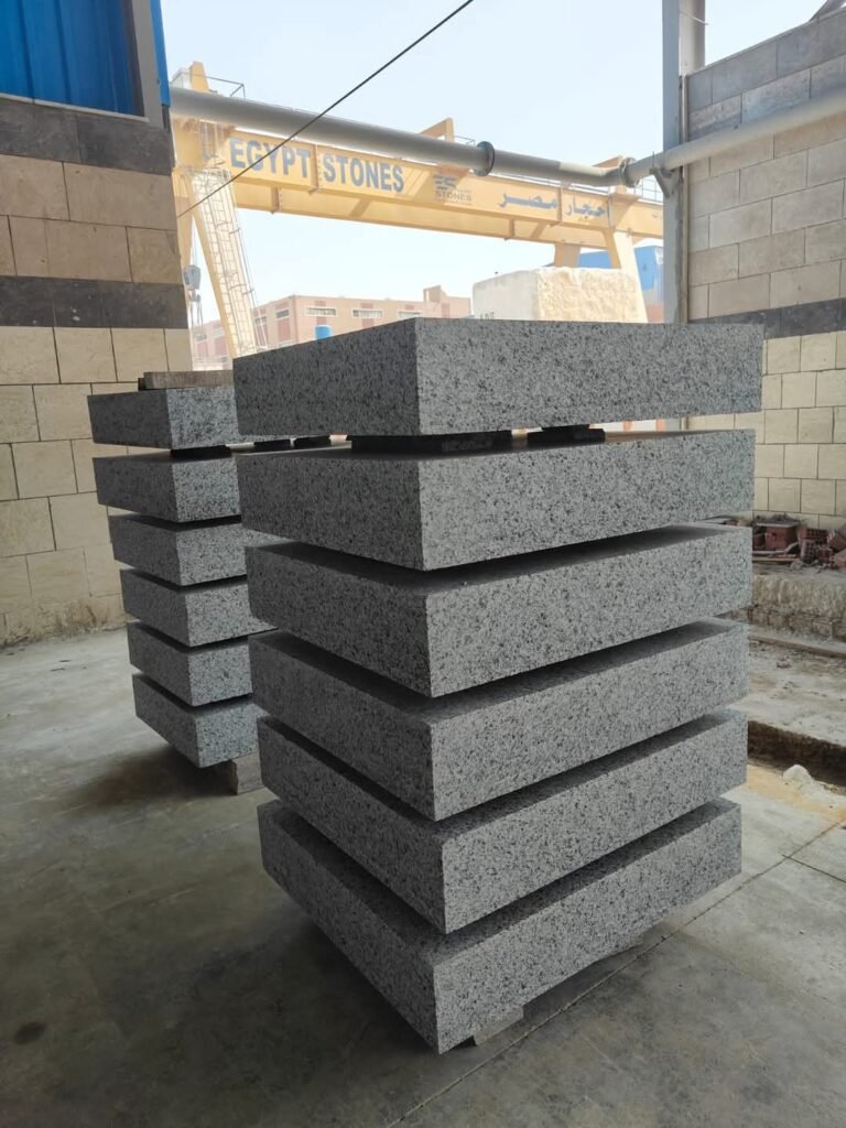 Marble Slabs in Factory – “High-quality natural marble slabs in a factory ready for cutting and polishing.”