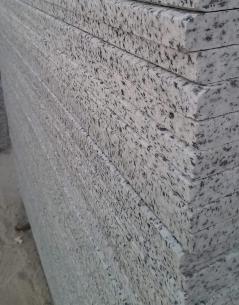 Marble Slabs in Factory – “High-quality natural marble slabs in a factory ready for cutting and polishing.”